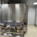 OPTIMA SHT 13 depyrogenation tunnel with outfeed conveyor into the filling room