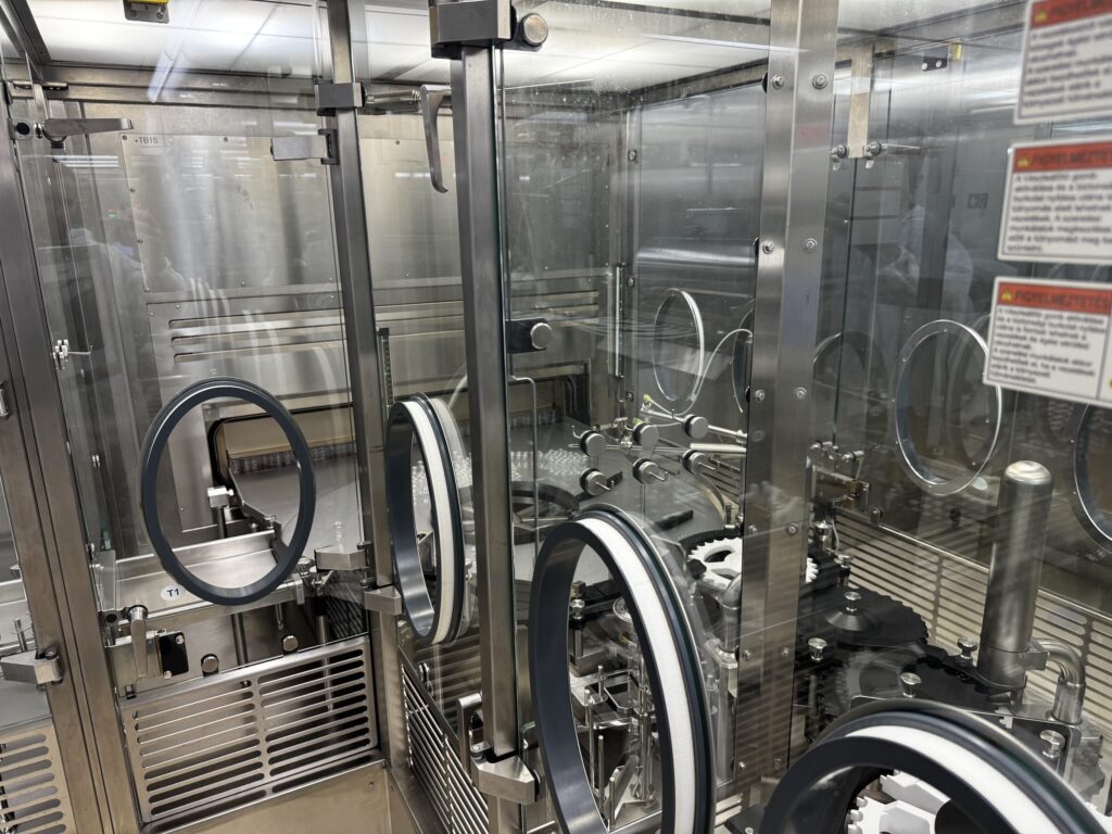OPTIMA VFVM 18000 aseptic vial filling and stoppering machine under active open-RABS with glove ports