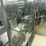 Glazed open-RABS enclosure over the OPTIMA VFVM 18000 vial filling machine