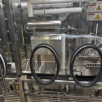 Stoppering station inside the open-RABS of the OPTIMA VFVM 18000 filling machine