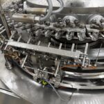 Vial transfer star and capping heads of the OPTIMA VVM 2428 capping machine