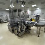 OPTIMA WMR 2400 rotary vial washing machine with infeed turntable in the cleanroom