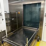 Belimed PH 860.2 pass-through washer-disinfector in cleanroom wall