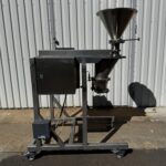 Hosokawa Bepex Bexmill BM 150 seen from the side with the inlet hopper