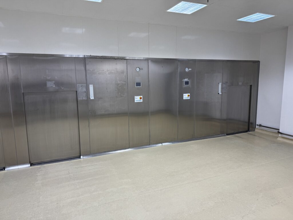 Telstar double-door pass-through autoclaves installed in a sterile production corridor