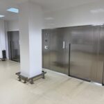 Telstar pass-through autoclave wall seen from the clean side of the corridor