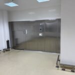 Telstar double-door autoclaves built into the partition wall between two zones