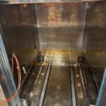 Stainless steel chamber interior of the Telstar autoclave with cart rails