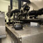 Pipework, valves and instrumentation above the Getinge sterilizer in the service area
